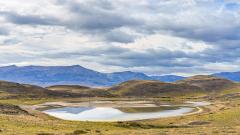 Circular lake & mtns in Patagonia - Robyn Miller